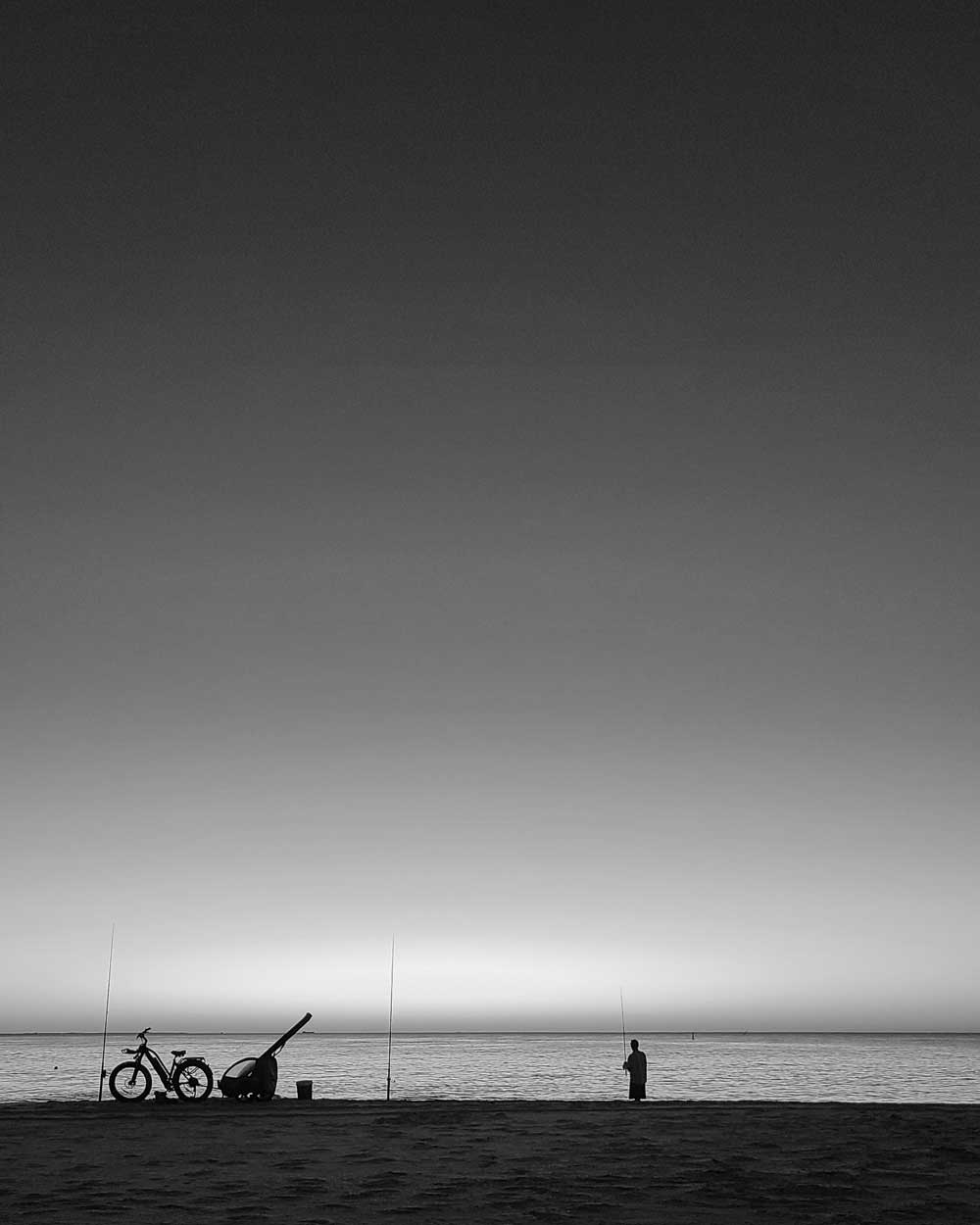 fishing-city-beach-australia A fisherman on the beach, City Beach, Western australia, Australia