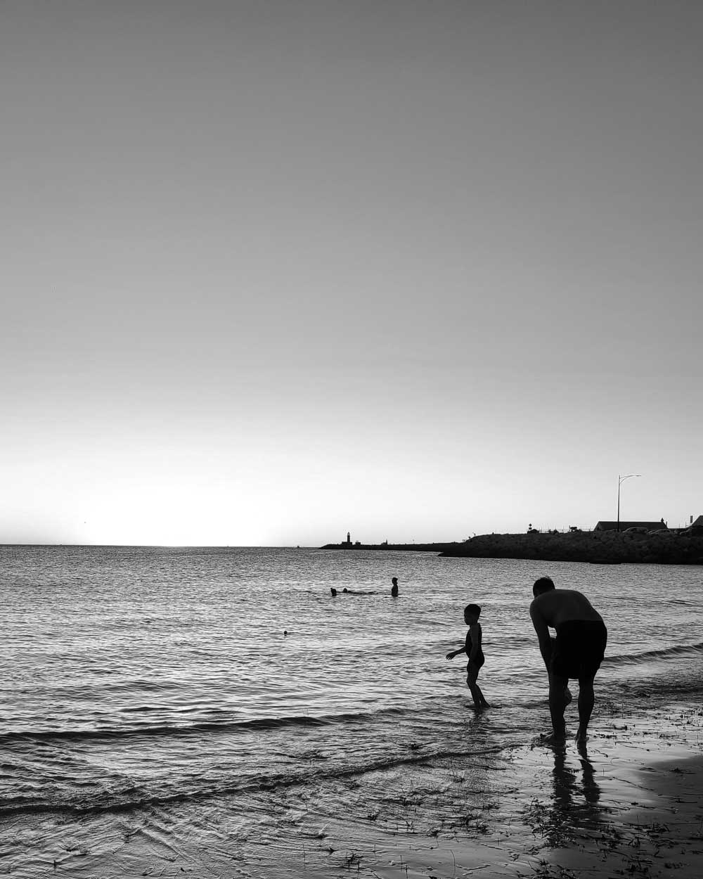freo-beach-western-australia A father and his son on the beach, Fremantle, Western Australia, Australia